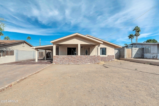 view of front of home with a carport