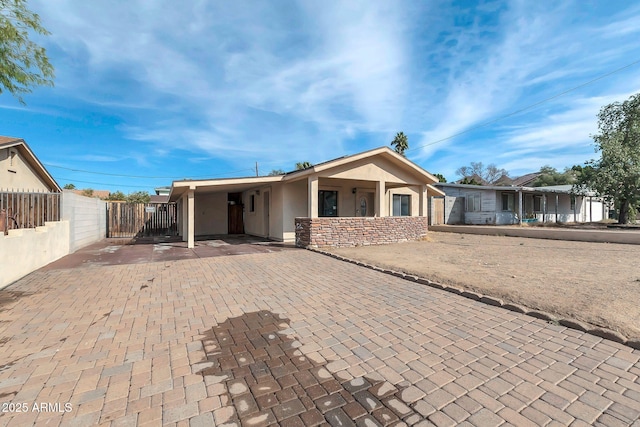 view of front of property with a carport