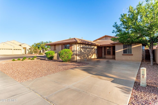 2315 W Beverly Rd, Phoenix, AZ 85041 - single story home featuring an attached garage, stucco siding, fence, and concrete driveway