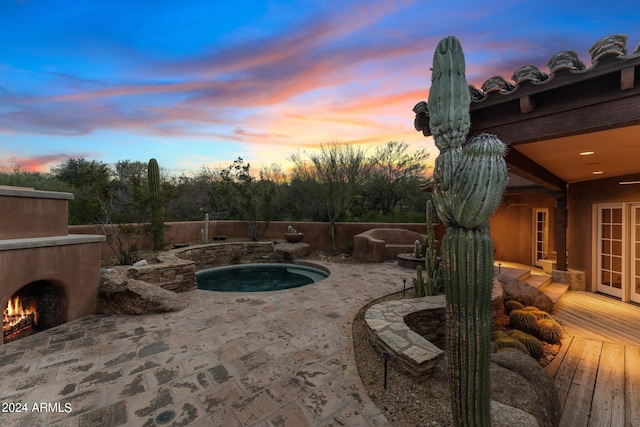 view of patio terrace at dusk