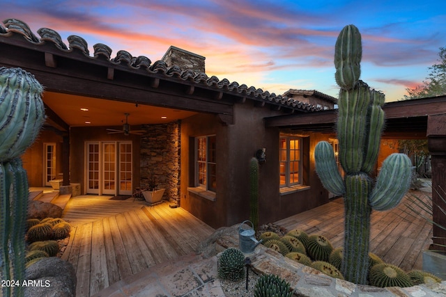 exterior space featuring a deck and french doors