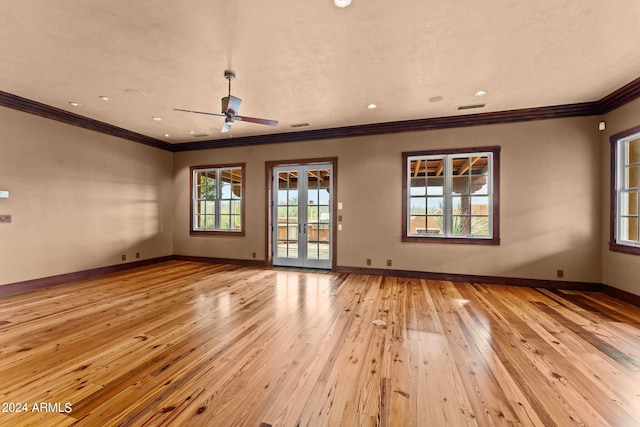 spare room featuring ornamental molding, wood-type flooring, and ceiling fan