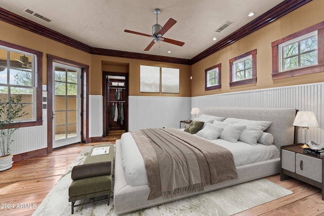 bedroom featuring access to outside, ornamental molding, ceiling fan, and light hardwood / wood-style flooring