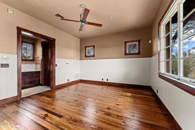 spare room featuring ceiling fan and hardwood / wood-style flooring