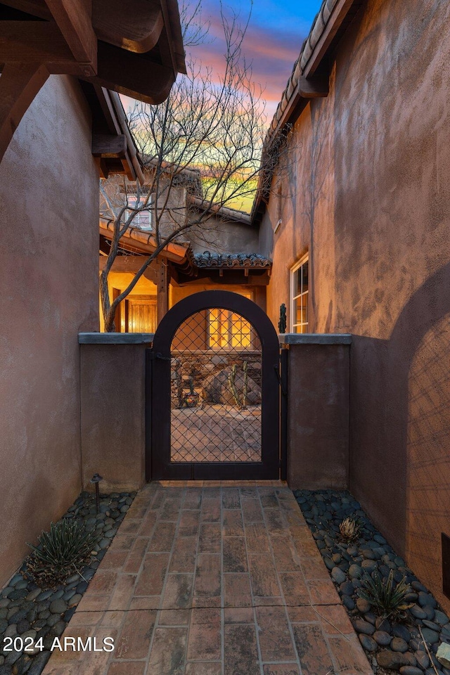 view of exterior entry at dusk