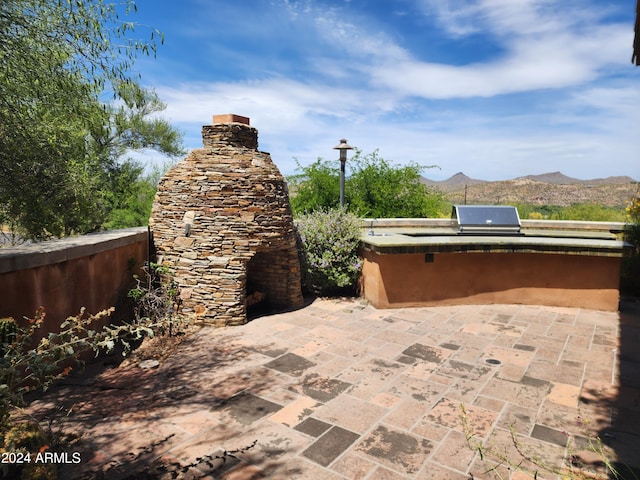 view of terrace featuring a mountain view