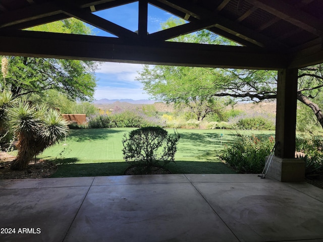 view of patio / terrace featuring a mountain view