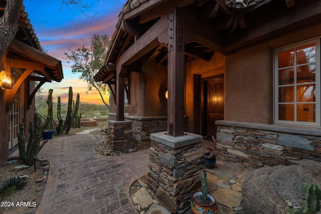 view of patio terrace at dusk