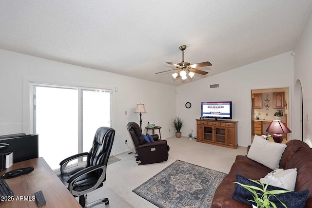 carpeted office featuring a textured ceiling, ceiling fan, and lofted ceiling