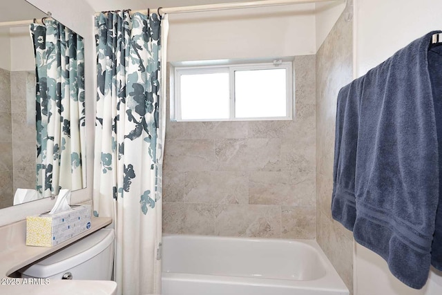 bathroom with toilet and shower / bath combo with shower curtain