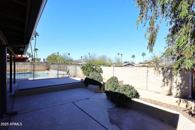 view of patio / terrace with a fenced in pool