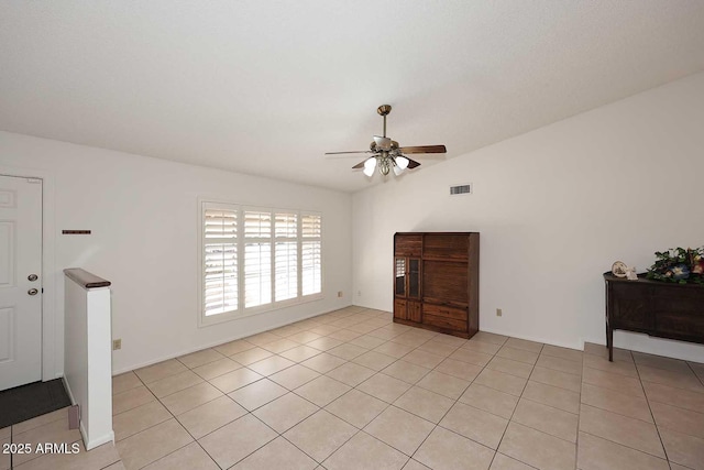 interior space featuring ceiling fan and vaulted ceiling