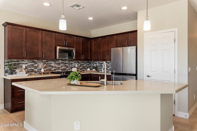 kitchen featuring a sink, appliances with stainless steel finishes, visible vents, light countertops, and dark brown cabinets