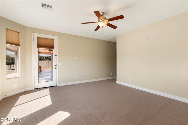 unfurnished room with ceiling fan and carpet flooring