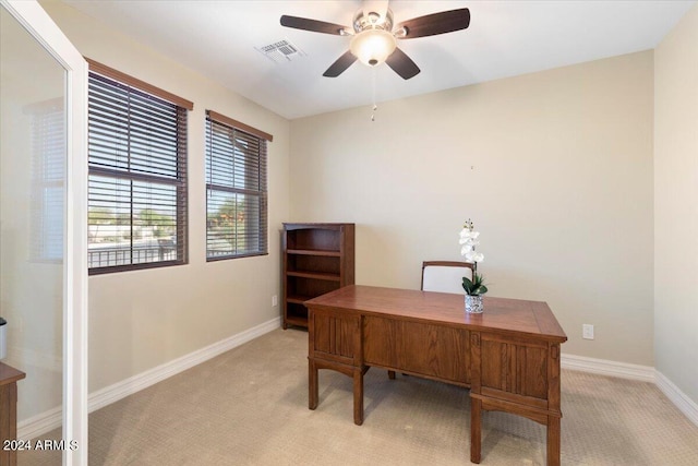 carpeted office with ceiling fan