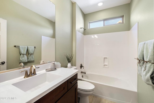 full bath with wood finished floors, toilet, shower / tub combination, and vanity