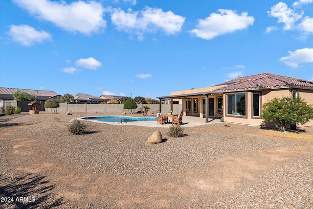 view of swimming pool with a patio, a fenced in pool, and a fenced backyard