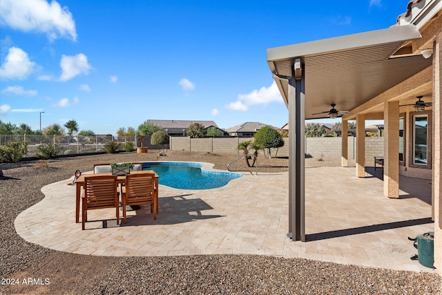 view of pool featuring a fenced backyard, a ceiling fan, a fenced in pool, and a patio area