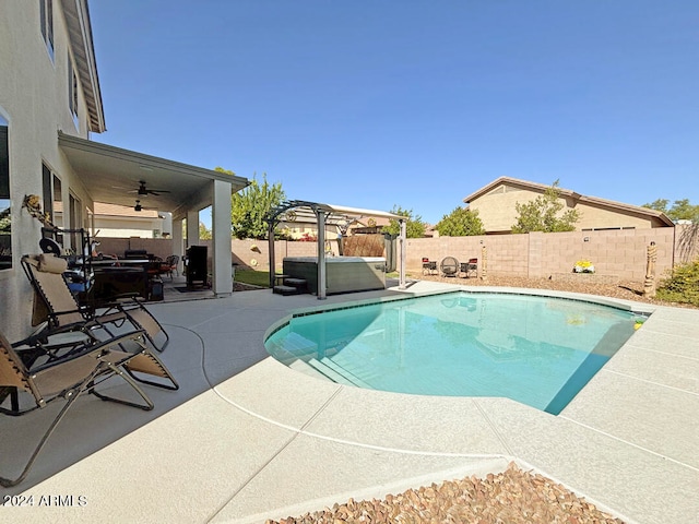 view of swimming pool featuring a pergola, a patio, and ceiling fan