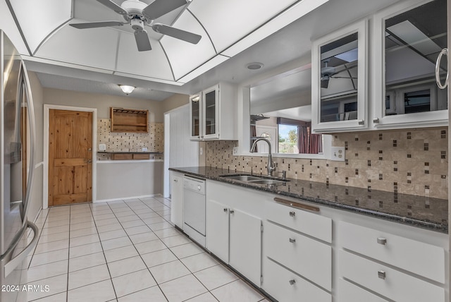 kitchen featuring white cabinetry, sink, dishwasher, stainless steel fridge with ice dispenser, and decorative backsplash