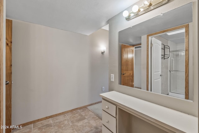 bathroom featuring tile patterned floors and vanity