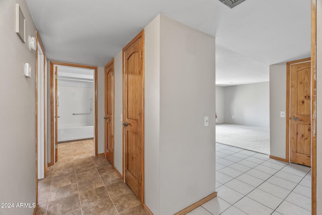 hallway with light carpet