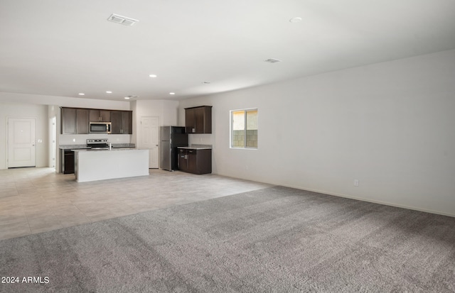 unfurnished living room with light carpet