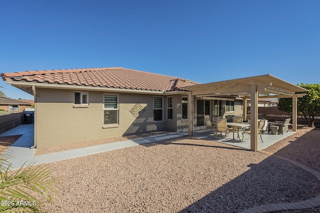 back of house featuring a pergola and a patio area