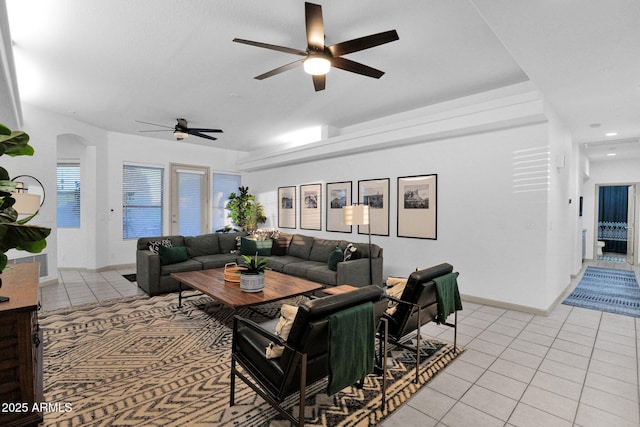 18161 N 63rd Ln, Glendale, AZ 85308 - living area with baseboards, ceiling fan, arched walkways, light tile patterned flooring, and recessed lighting