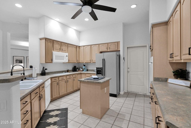 18161 N 63rd Ln, Glendale, AZ 85308 - kitchen with a ceiling fan, light brown cabinets, white appliances, a sink, and a kitchen island