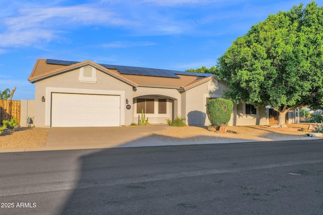 18161 N 63rd Ln, Glendale, AZ 85308 - ranch-style house featuring stucco siding, driveway, solar panels, and a garage