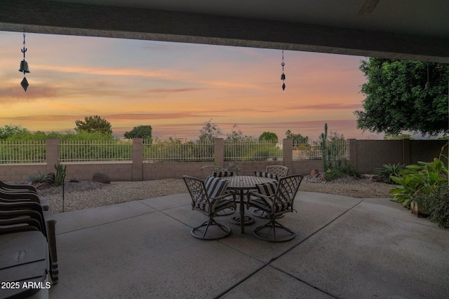 18161 N 63rd Ln, Glendale, AZ 85308 - patio terrace at dusk with fence and outdoor dining space