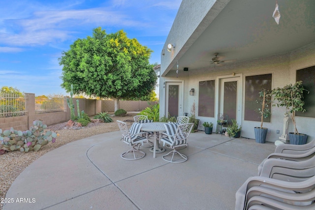 18161 N 63rd Ln, Glendale, AZ 85308 - view of patio / terrace with outdoor dining space, ceiling fan, and a fenced backyard