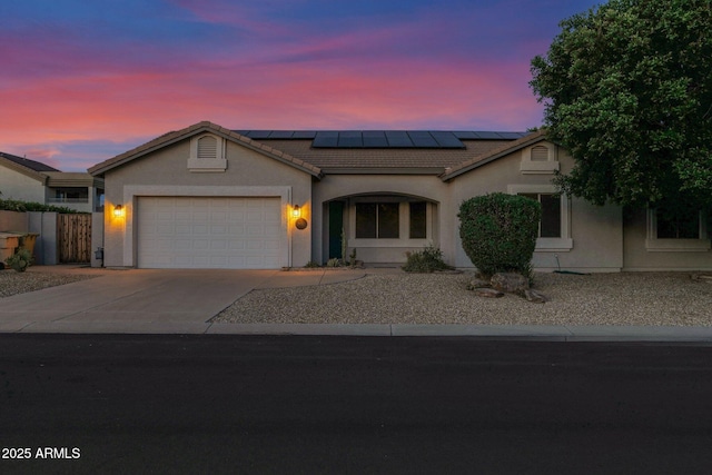 18161 N 63rd Ln, Glendale, AZ 85308 - single story home featuring roof mounted solar panels, a garage, a tiled roof, stucco siding, and driveway