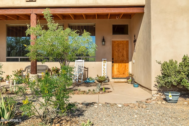 entrance to property with a patio area