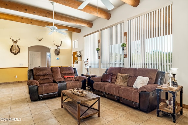 tiled living room with beamed ceiling