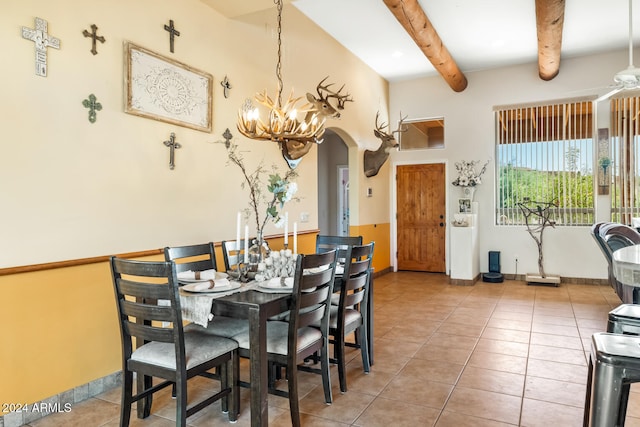 dining room with tile patterned flooring and beam ceiling