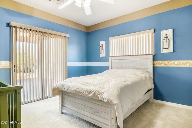 bedroom featuring ceiling fan and carpet