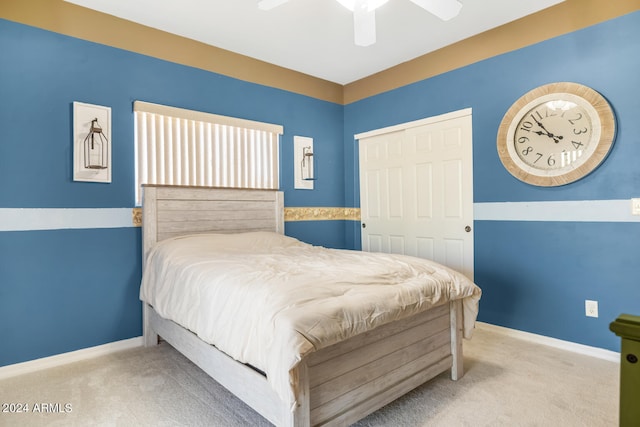 bedroom with ceiling fan, a closet, and carpet