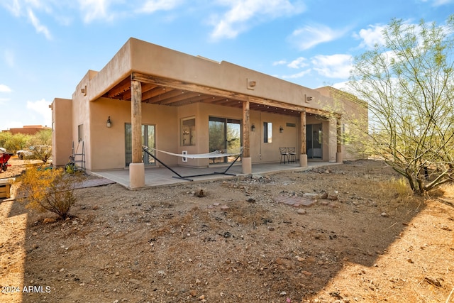 rear view of property featuring a patio area