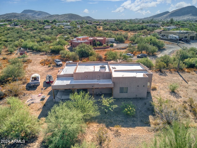 birds eye view of property with a mountain view