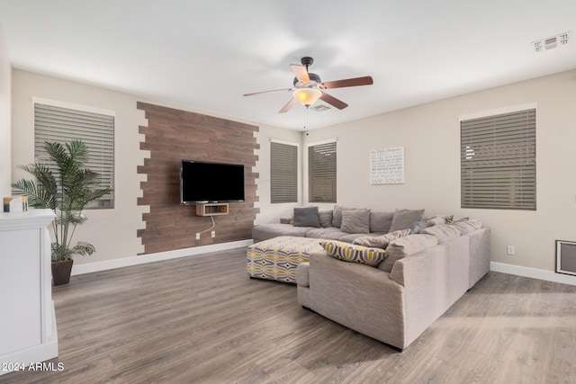 living room featuring hardwood / wood-style flooring and ceiling fan