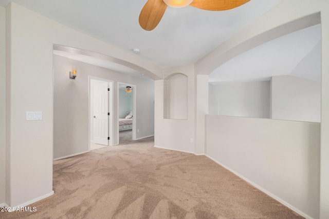 hall with carpet floors and lofted ceiling