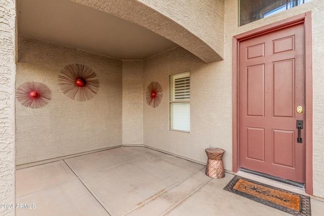 property entrance featuring covered porch