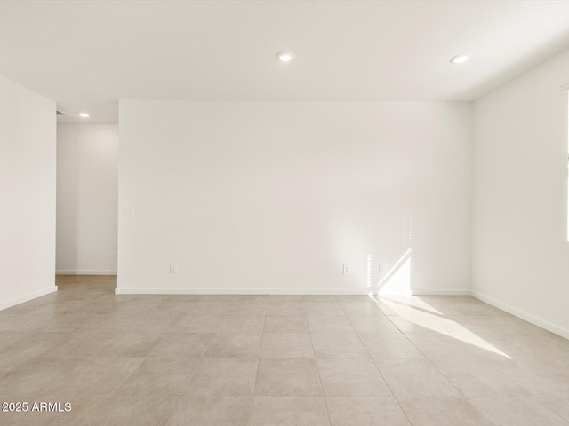 unfurnished room with light tile patterned floors