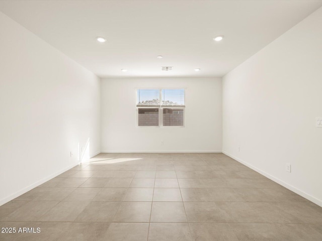 unfurnished room with light tile patterned floors