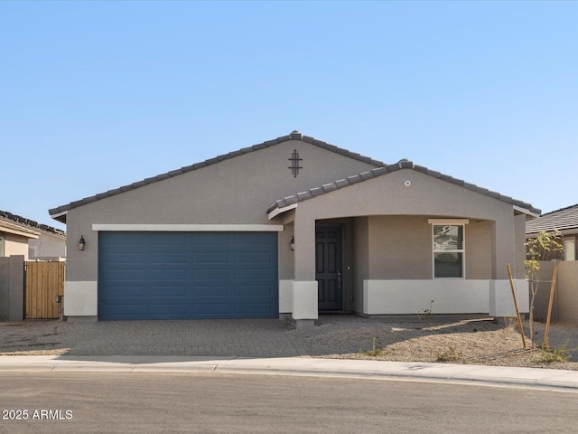 ranch-style house featuring a garage