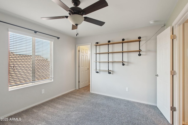 unfurnished bedroom with carpet floors and ceiling fan