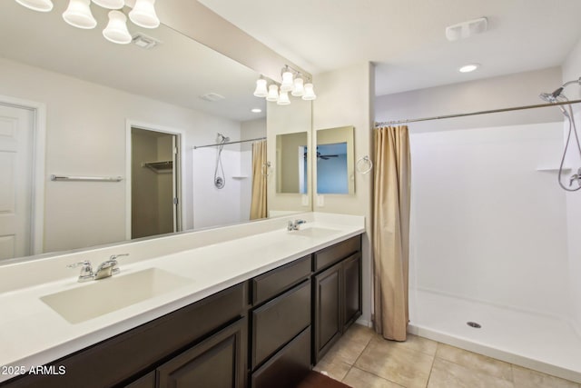 bathroom with vanity, a shower with shower curtain, and tile patterned flooring