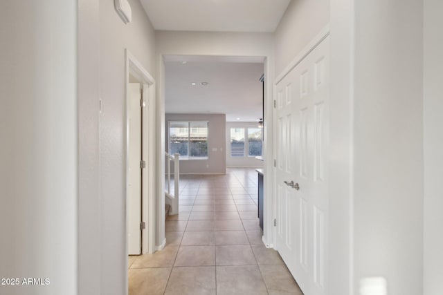 corridor with light tile patterned floors